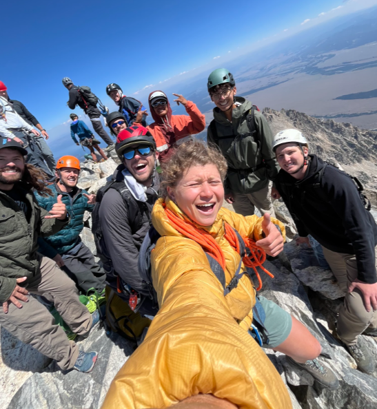 An image of my team and I summiting the grand teton